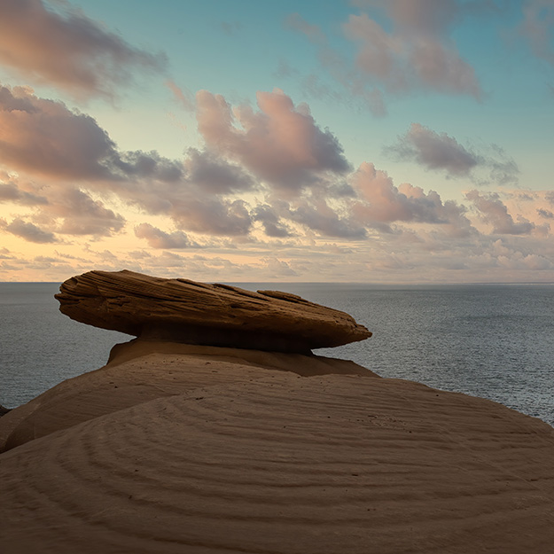 Balanced rock in front of ocean