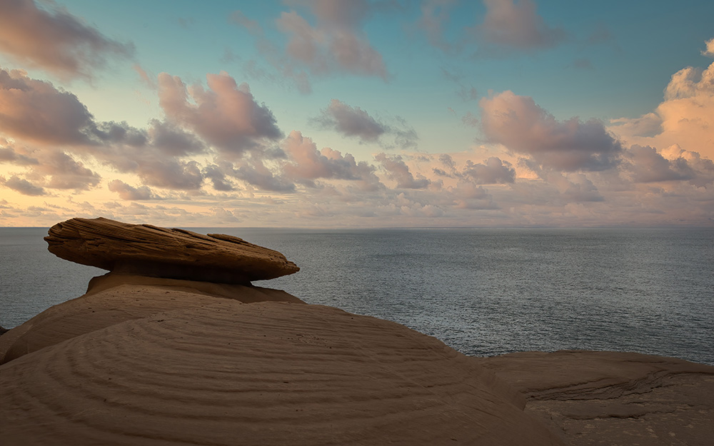 Balanced rock in front of ocean